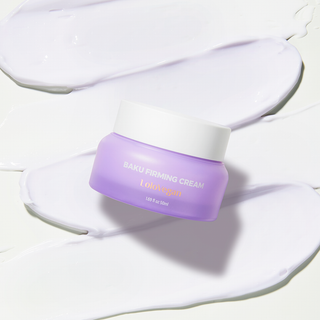 Jar of Baku Firming Cream with cream spread on a beige background