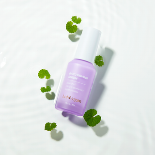 Baku Firming Serum bottle with a white cap on a beige background